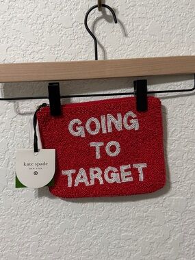 kate spade red beaded pouch with white text
